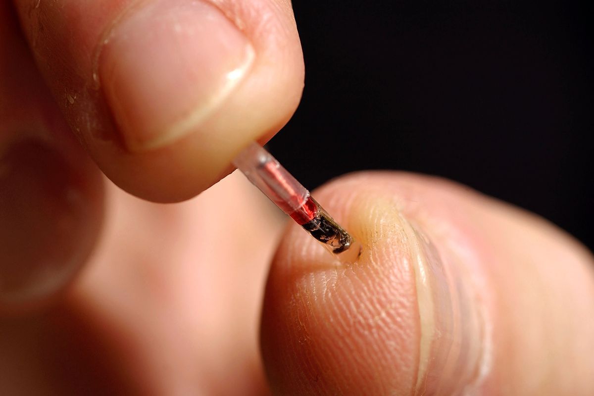 Would it be possible for a government to insert microchips in a vaccine?